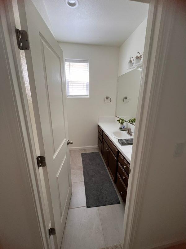 4106 Dennis Drive Clovis, CA 93619 - Photo 6 of 17 a bathroom with a sink a washer and dryer
