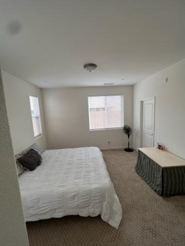 4106 Dennis Drive Clovis, CA 93619 - Photo 10 of 17 a bedroom with a bed and window