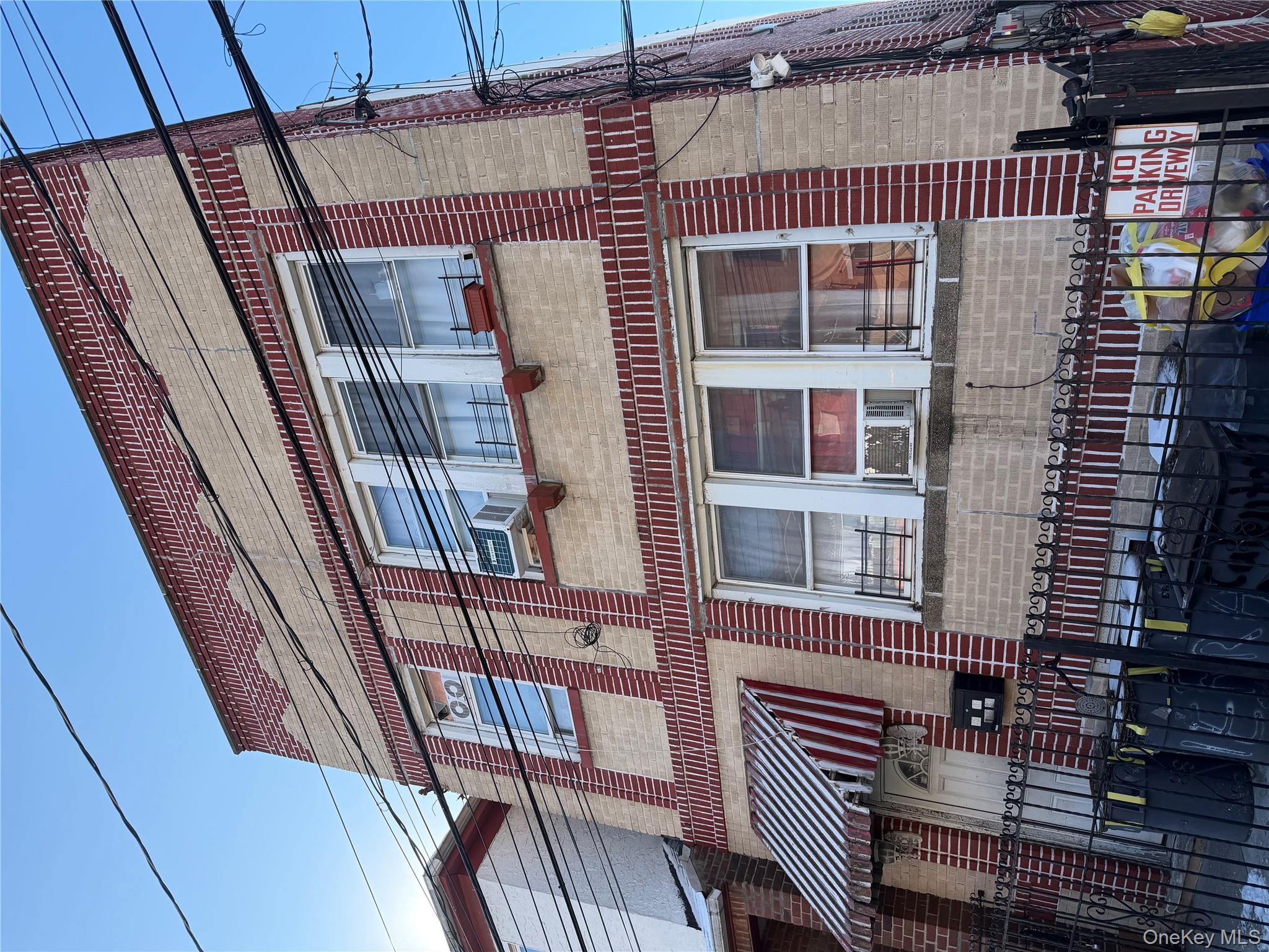 53-04 106th Street Queens, NY 11368 - Photo 1 of 8 a front view of a building