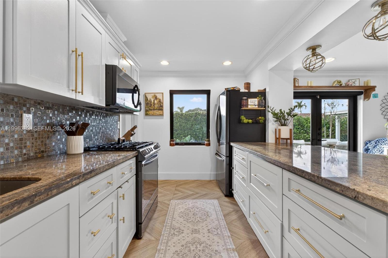 13441 Southwest 74th Street Miami, FL 33183 - Photo 12 of 51 a large kitchen with granite countertop a sink and dishwasher stove top oven