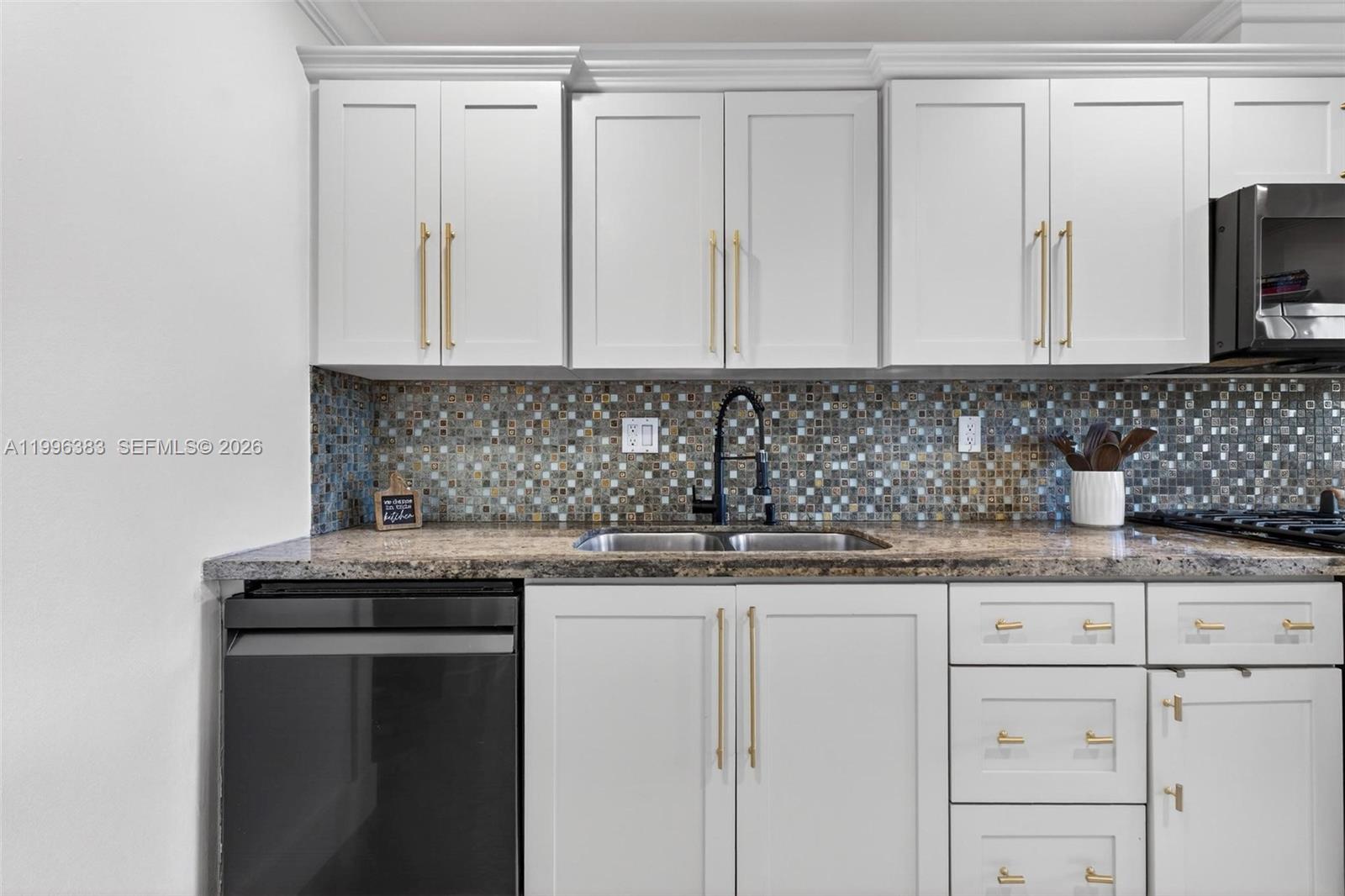 13441 Southwest 74th Street Miami, FL 33183 - Photo 14 of 51 a kitchen with granite countertop a sink and a stove