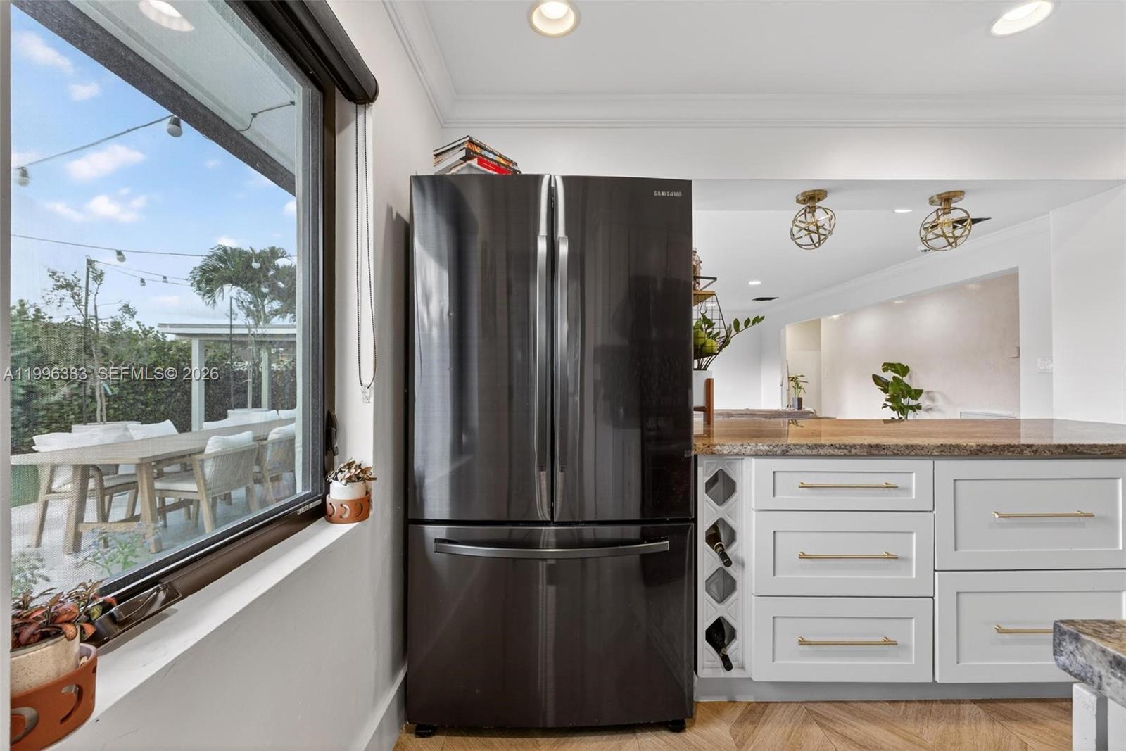 13441 Southwest 74th Street Miami, FL 33183 - Photo 15 of 51 a kitchen with a refrigerator and a wooden floor