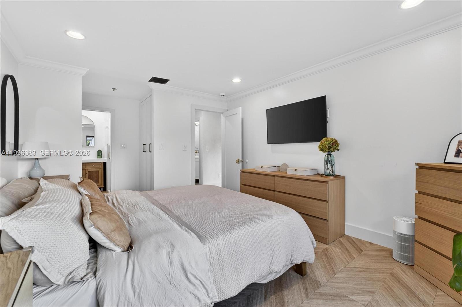 13441 Southwest 74th Street Miami, FL 33183 - Photo 22 of 51 a bedroom with a bed and a flat screen tv