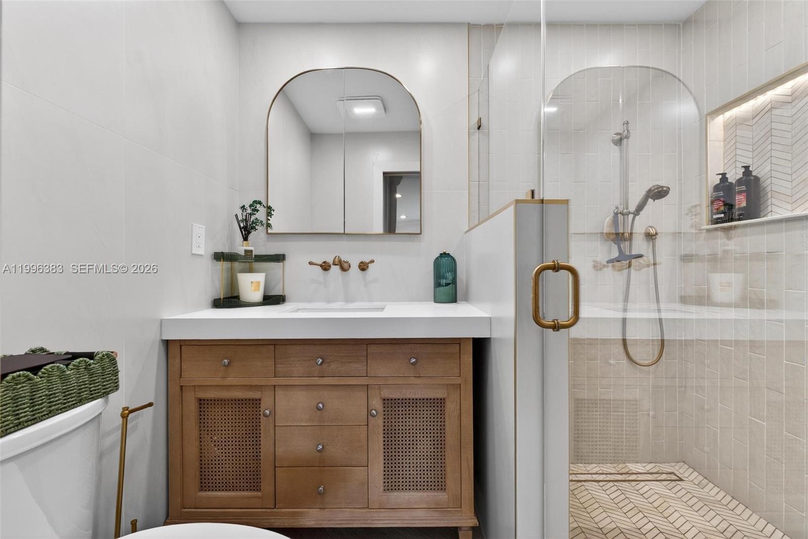 13441 Southwest 74th Street Miami, FL 33183 - Photo 23 of 51 a bathroom with a sink and a mirror