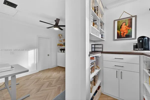 a view of a bedroom with washer and dryer