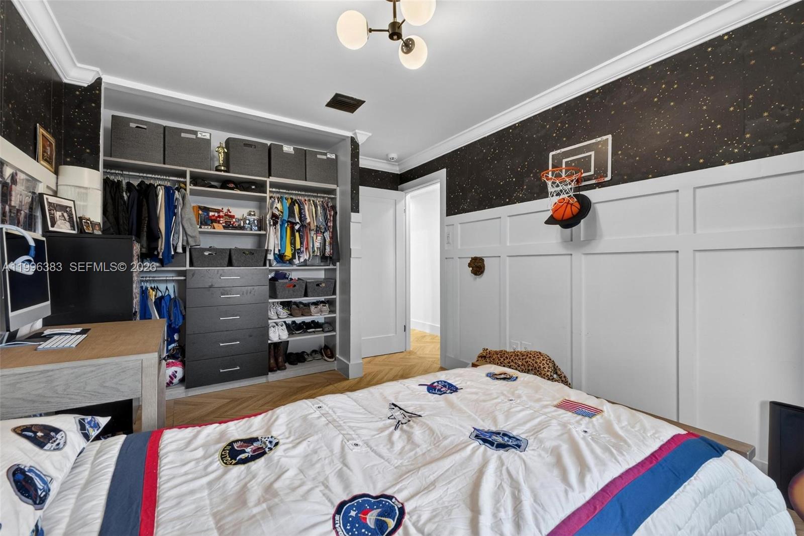 13441 Southwest 74th Street Miami, FL 33183 - Photo 32 of 51 a bedroom with a bed and a chandelier