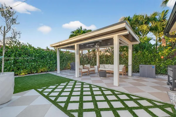 a living room with furniture a garden and a table