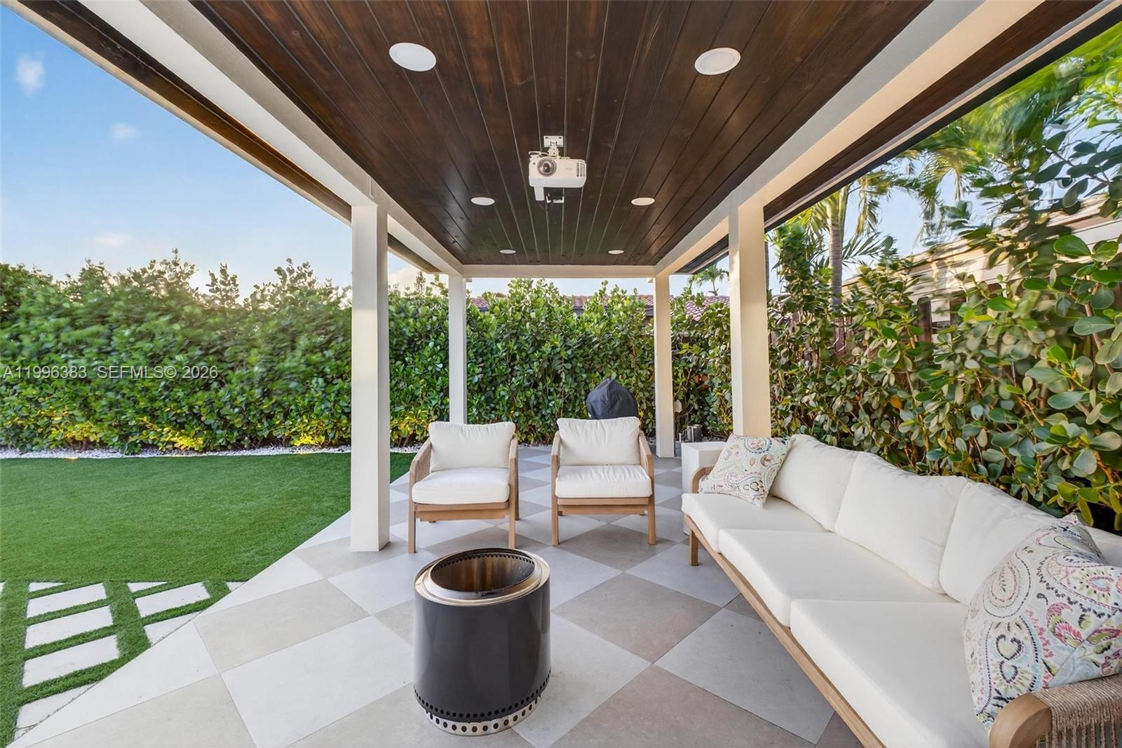 13441 Southwest 74th Street Miami, FL 33183 - Photo 36 of 51 a living room with patio furniture and garden