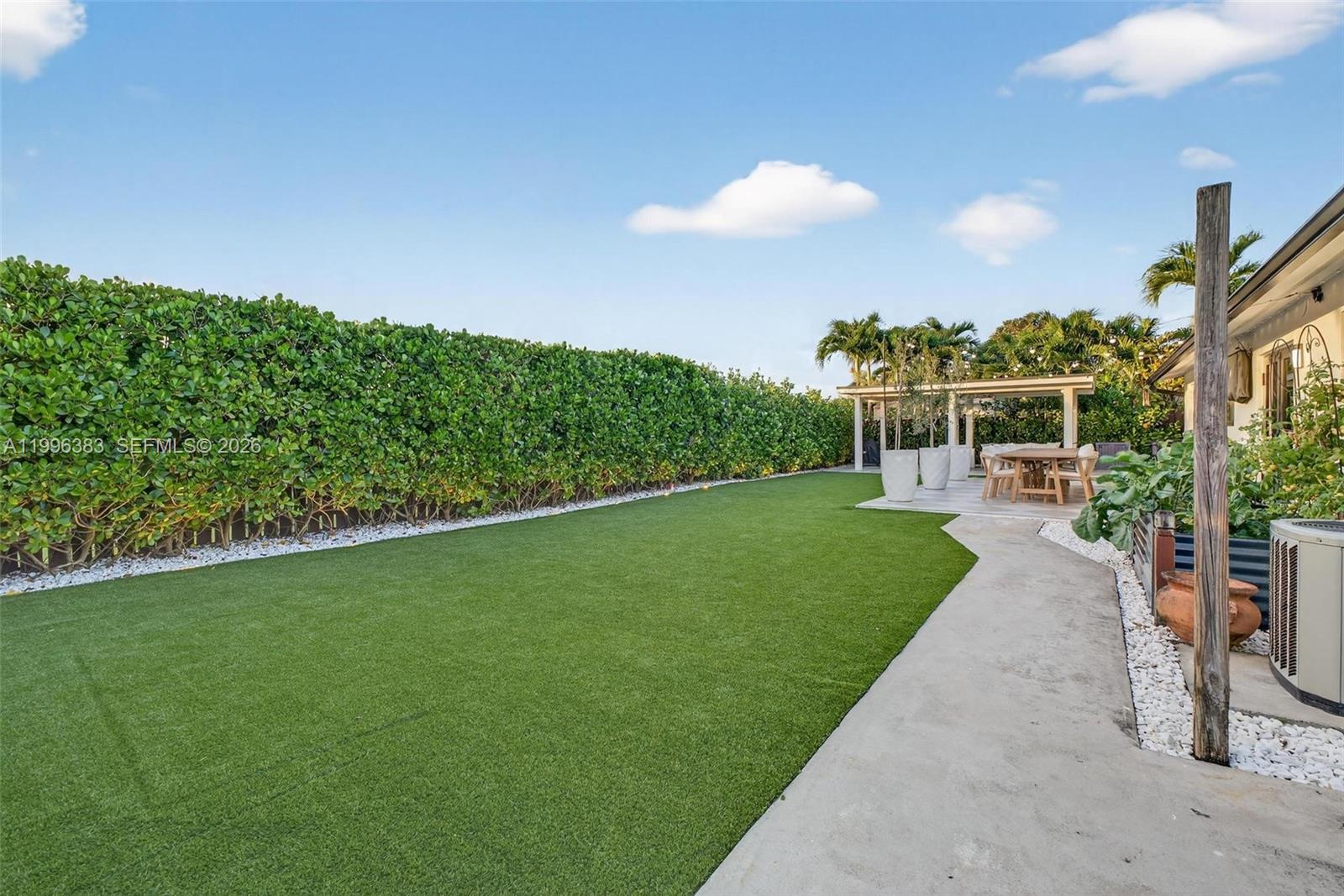 13441 Southwest 74th Street Miami, FL 33183 - Photo 39 of 51 a view of a back yard of the house and green space