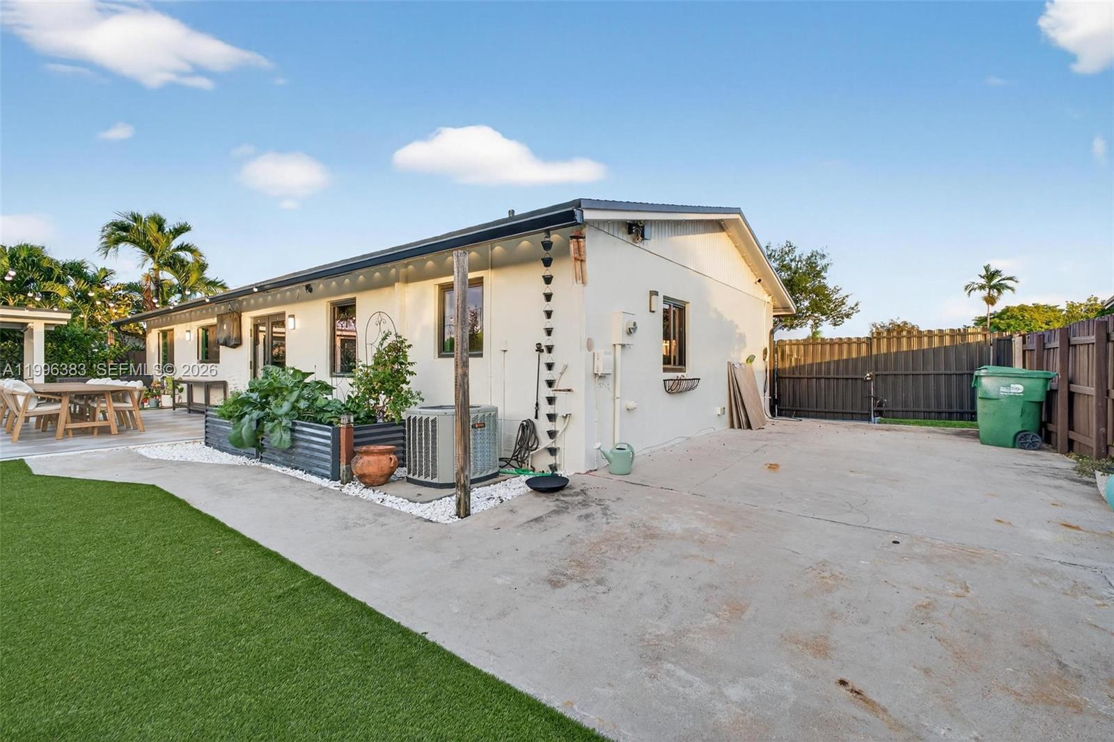13441 Southwest 74th Street Miami, FL 33183 - Photo 41 of 51 a view of a porch with furniture and floor to ceiling window