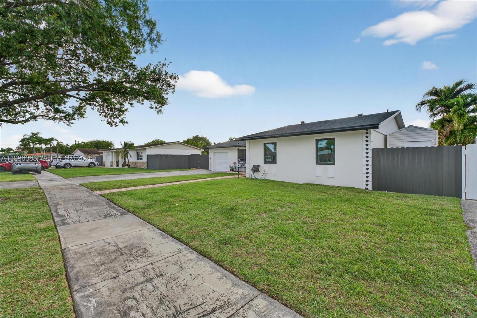 13441 Southwest 74th Street Miami, FL 33183 - Photo 42 of 51 a view of a house with a backyard