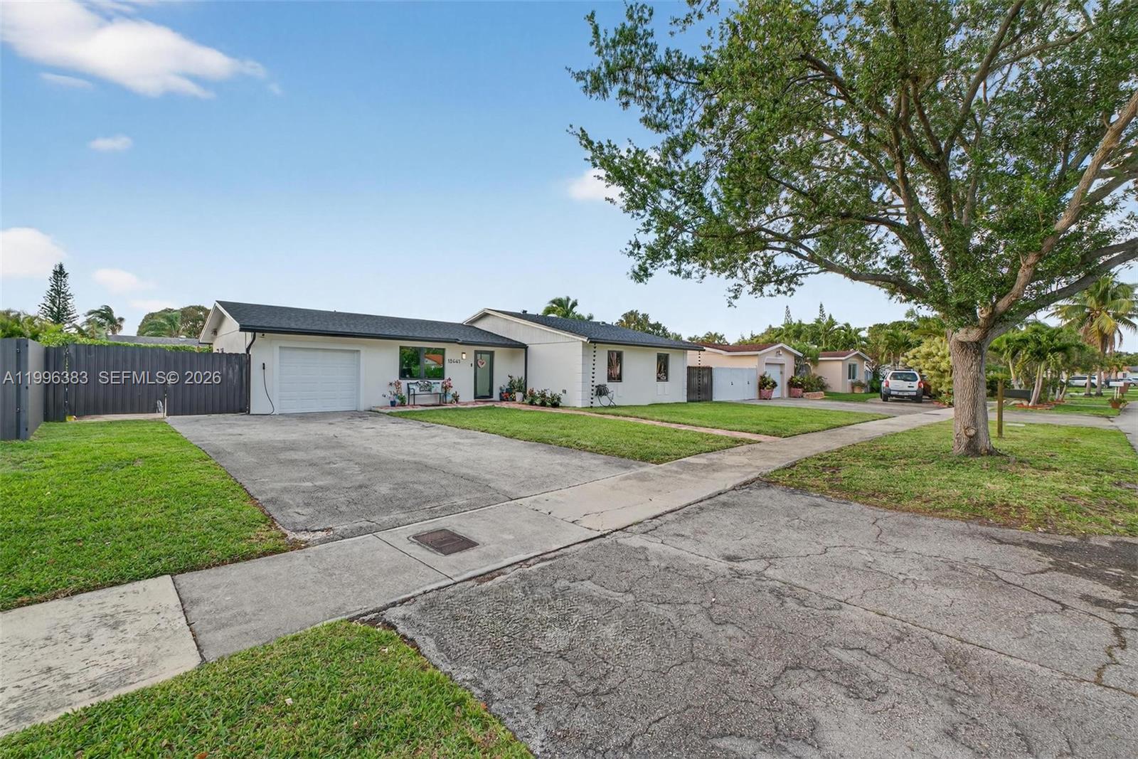 13441 Southwest 74th Street Miami, FL 33183 - Photo 43 of 51 a view of house with a yard