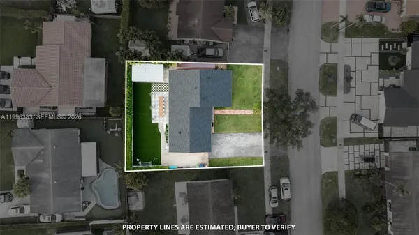 an aerial view of residential building with green space