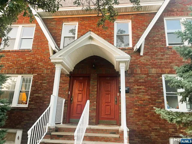 a front view of a house with a porch
