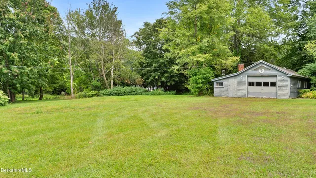 a house with swimming pool in front of it