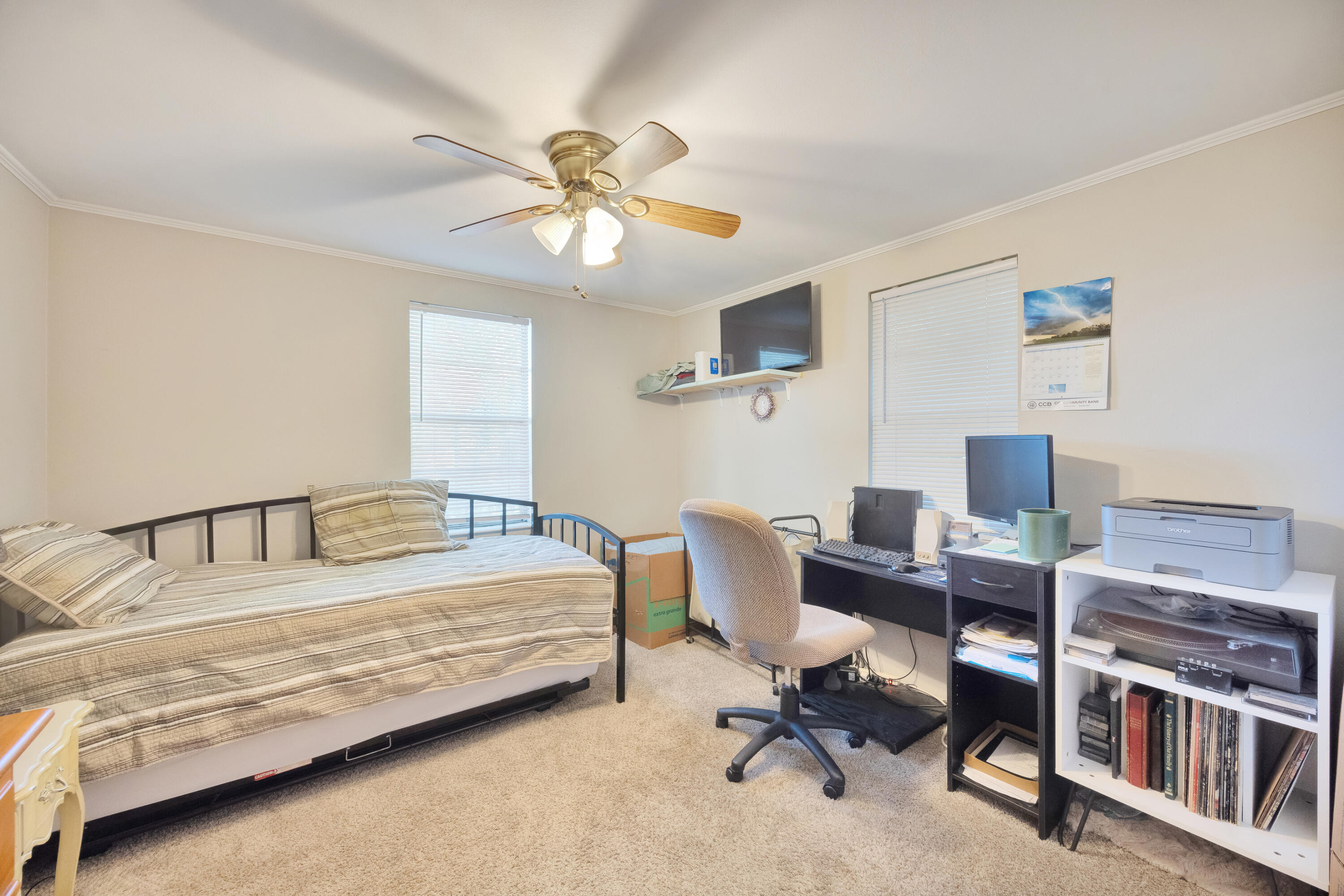 227 East 3rd Avenue Crestview, FL 32536 - Photo 14 of 26 a bedroom with a bed and a desk