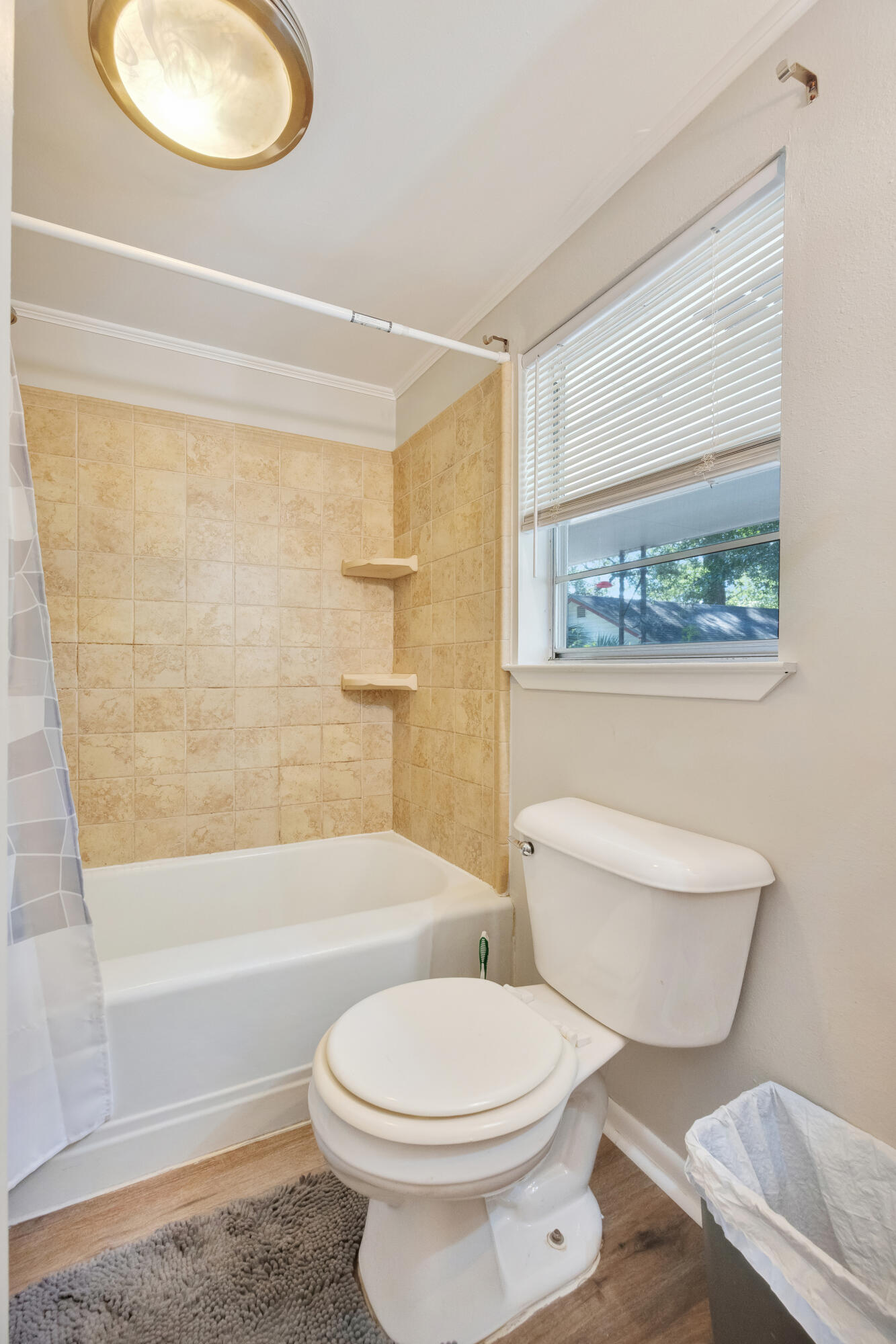 227 East 3rd Avenue Crestview, FL 32536 - Photo 17 of 26 a bathroom with a toilet a sink and a bathtub