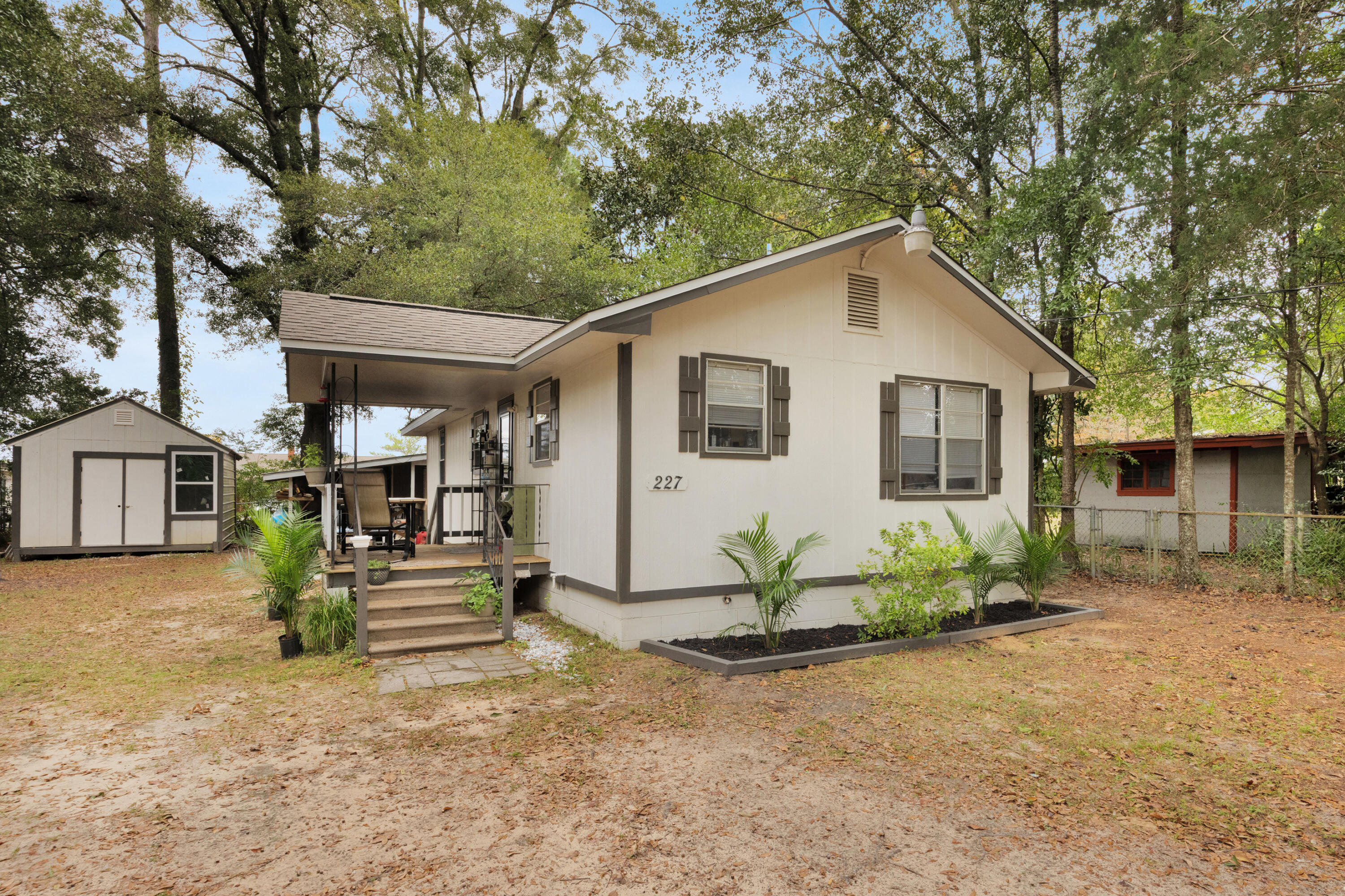 227 East 3rd Avenue Crestview, FL 32536 - Photo 4 of 26 a view of a house with a yard