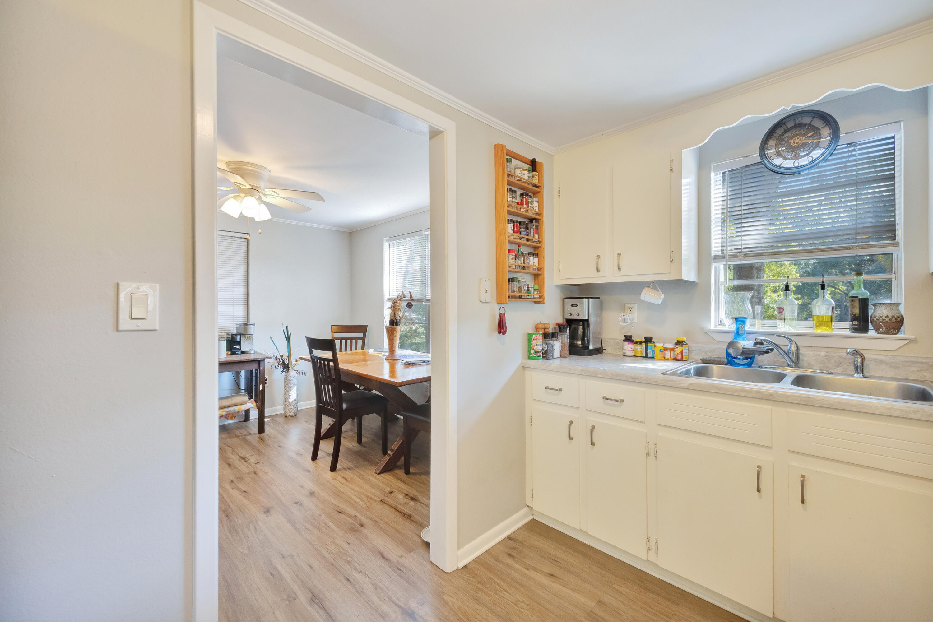 227 East 3rd Avenue Crestview, FL 32536 - Photo 8 of 26 a kitchen with cabinets appliances and a window