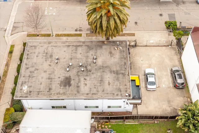 an aerial view of residential building and parking space