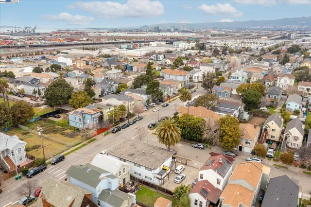an aerial view of residential building and ocean view