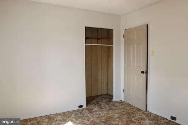 a room that has a window and a wooden floor