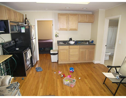 84 Mountford Road Hull, MA 02045 - Photo 23 of 30 a kitchen with stainless steel appliances kitchen island granite countertop a refrigerator stove oven and a sink