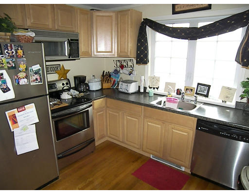 84 Mountford Road Hull, MA 02045 - Photo 24 of 30 a kitchen with stainless steel appliances granite countertop a stove a sink and a microwave