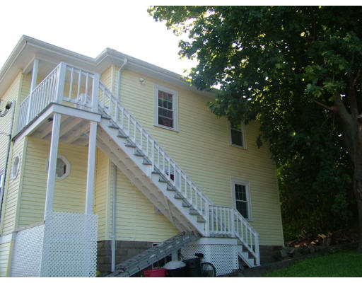 84 Mountford Road Hull, MA 02045 - Photo 4 of 30 a view of a house with a small yard
