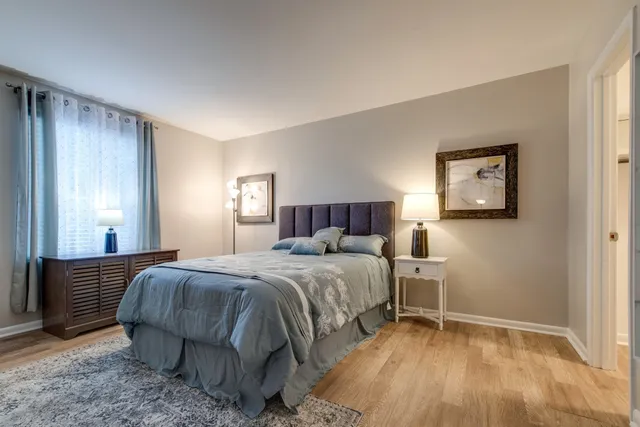 a bedroom with a bed and a walk in closet