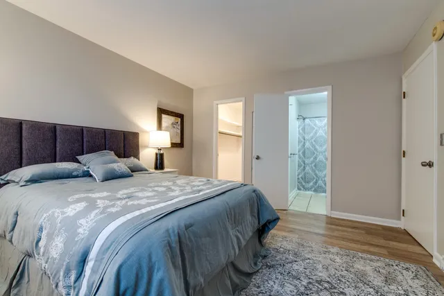 a bed room with a bed and a window