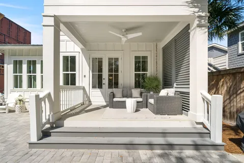 a view of balcony with furniture and floor to ceiling window