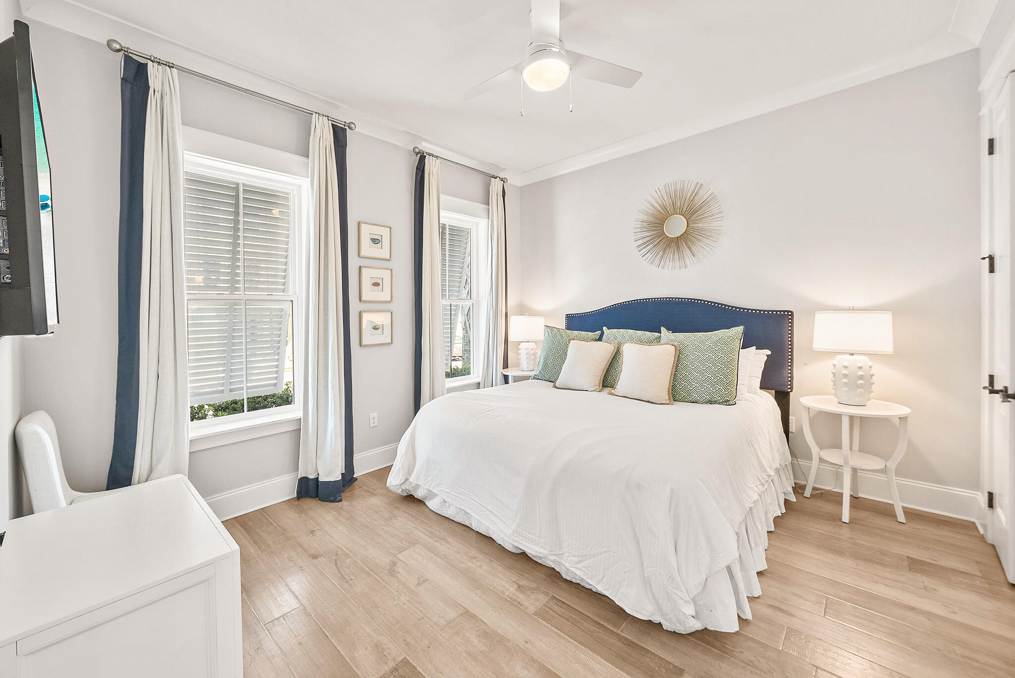 76 Brown Street Santa Rosa Beach, FL 32459 - Photo 18 of 48 a bedroom with a large bed and a chandelier