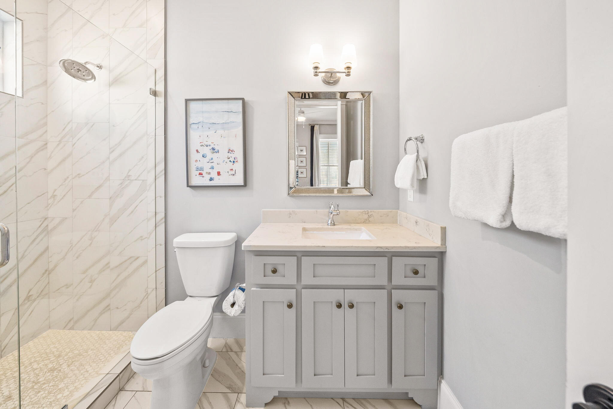 76 Brown Street Santa Rosa Beach, FL 32459 - Photo 19 of 48 a bathroom with a toilet sink and mirror