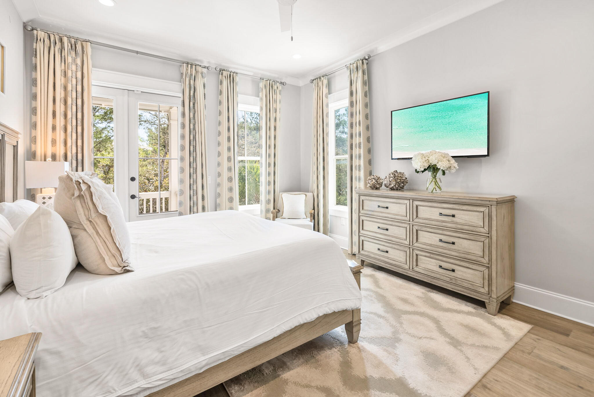 76 Brown Street Santa Rosa Beach, FL 32459 - Photo 23 of 48 a bedroom with a bed and a flat screen tv