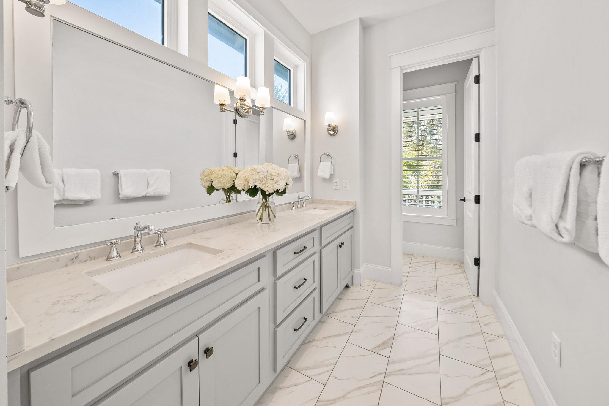 76 Brown Street Santa Rosa Beach, FL 32459 - Photo 25 of 48 a spacious bathroom with a granite countertop sink a mirror and a