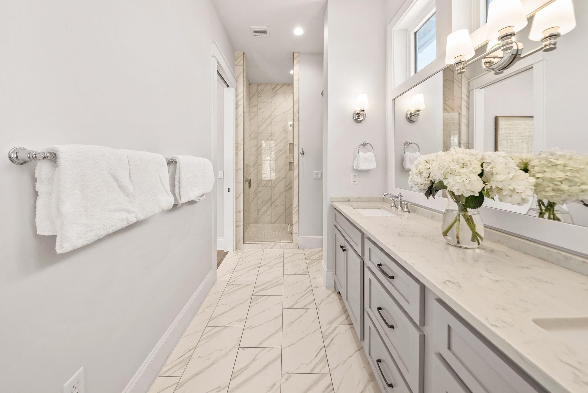 76 Brown Street Santa Rosa Beach, FL 32459 - Photo 26 of 48 a spacious bathroom with a granite countertop sink a mirror and a shower