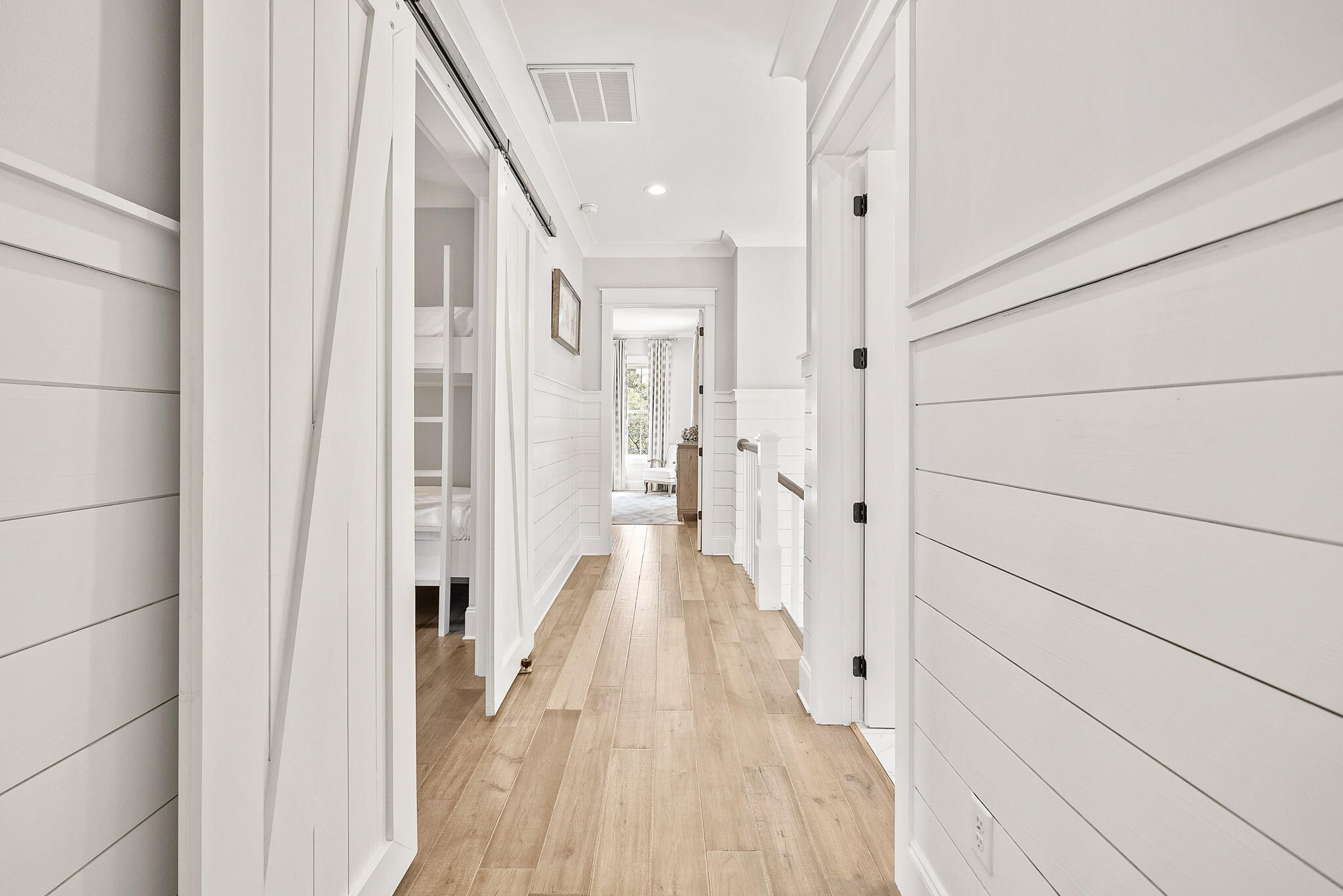 76 Brown Street Santa Rosa Beach, FL 32459 - Photo 28 of 48 a view of a hallway with wooden floor and staircase