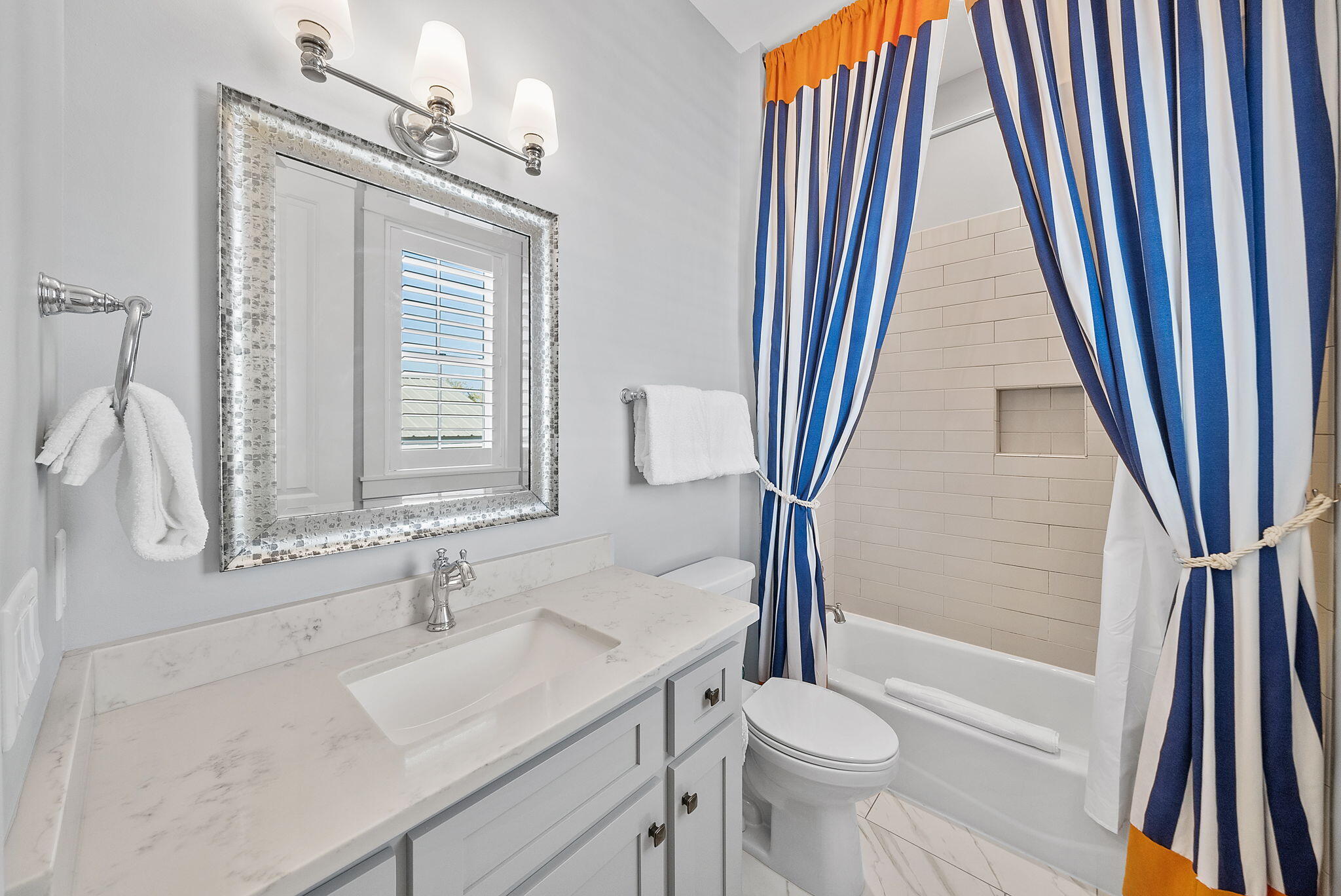 76 Brown Street Santa Rosa Beach, FL 32459 - Photo 33 of 48 a bathroom with a sink a toilet and a mirror