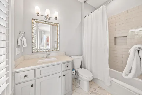 a view of a chair and table on the wooden deck
