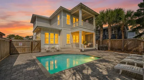 a aerial view of a house with a yard