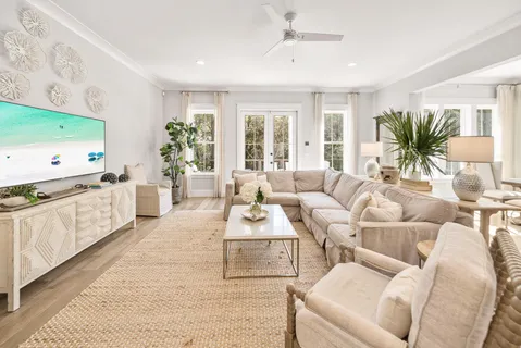 a kitchen with a white cabinets and chairs