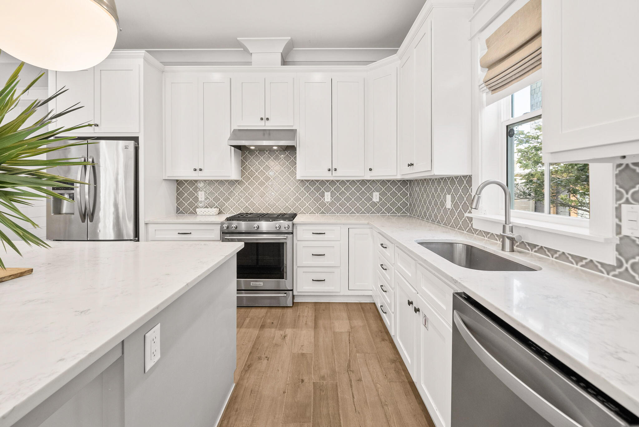 76 Brown Street Santa Rosa Beach, FL 32459 - Photo 9 of 48 a kitchen with granite countertop white cabinets and white appliances