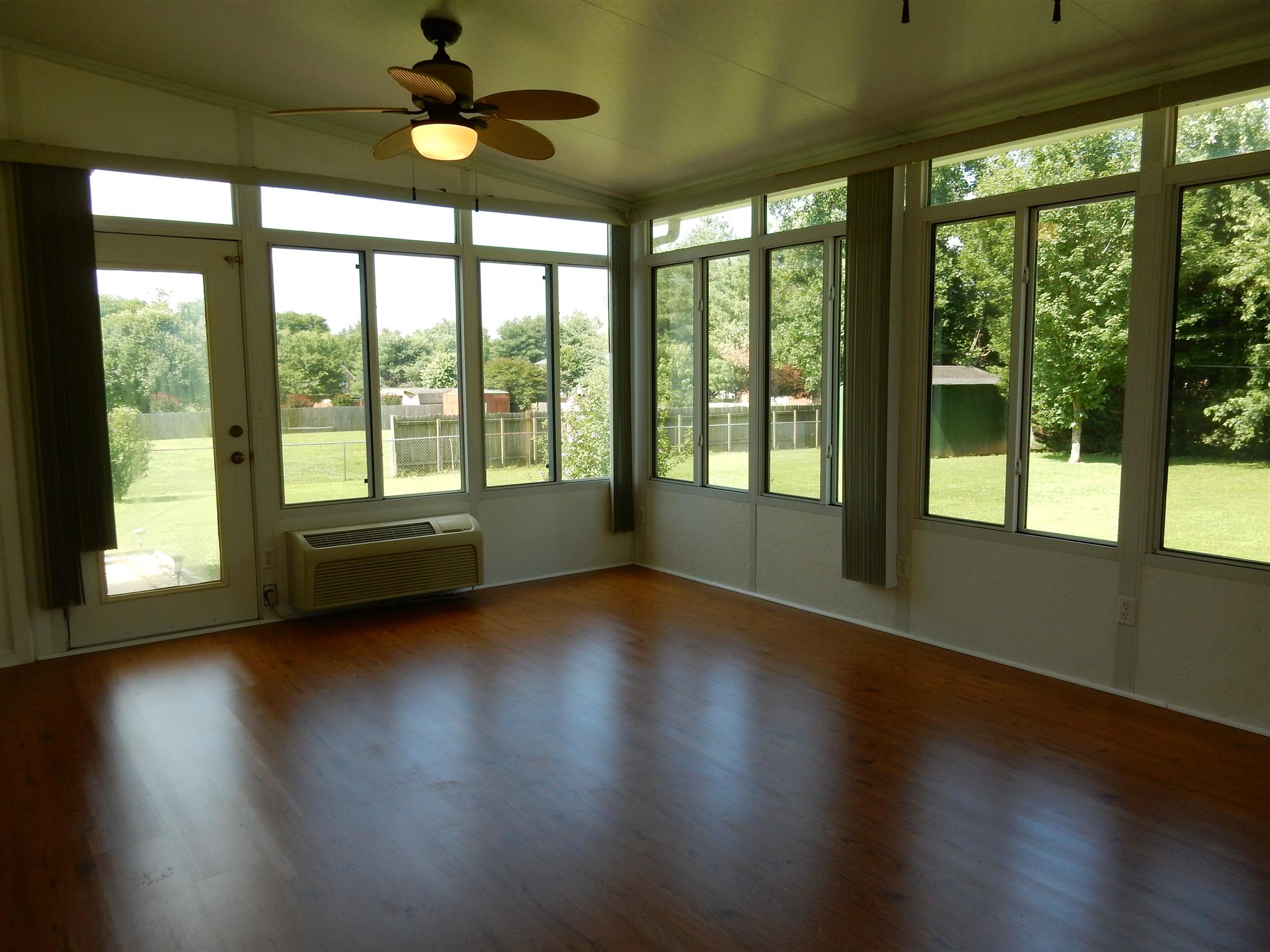 2884 Cages Bend Road Gallatin, TN 37066 - Photo 13 of 26 a view of an empty room with wooden floor and a window