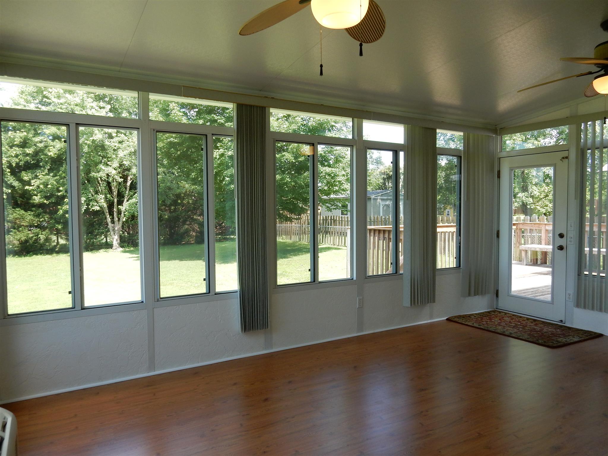 2884 Cages Bend Road Gallatin, TN 37066 - Photo 14 of 26 a view of an empty room with wooden floor and a window
