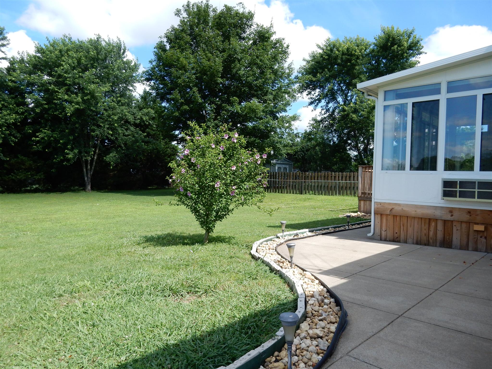 2884 Cages Bend Road Gallatin, TN 37066 - Photo 21 of 26 a view of a backyard with sitting area