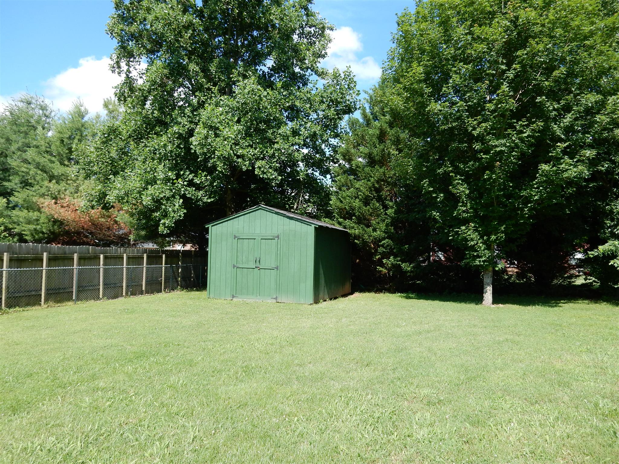 2884 Cages Bend Road Gallatin, TN 37066 - Photo 22 of 26 a house with trees in the background