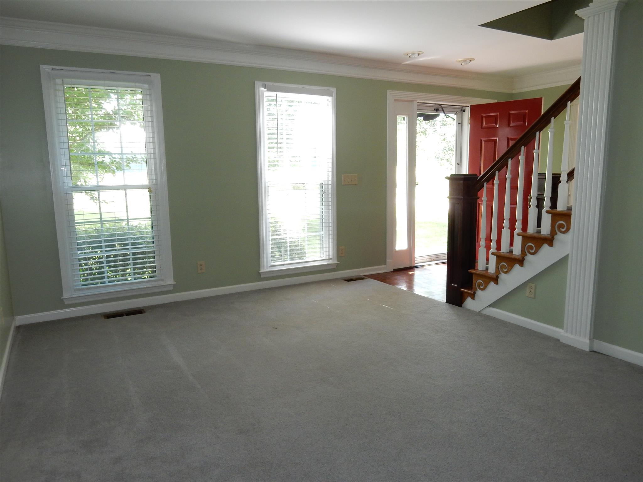 2884 Cages Bend Road Gallatin, TN 37066 - Photo 5 of 26 an empty room with stairs and windows