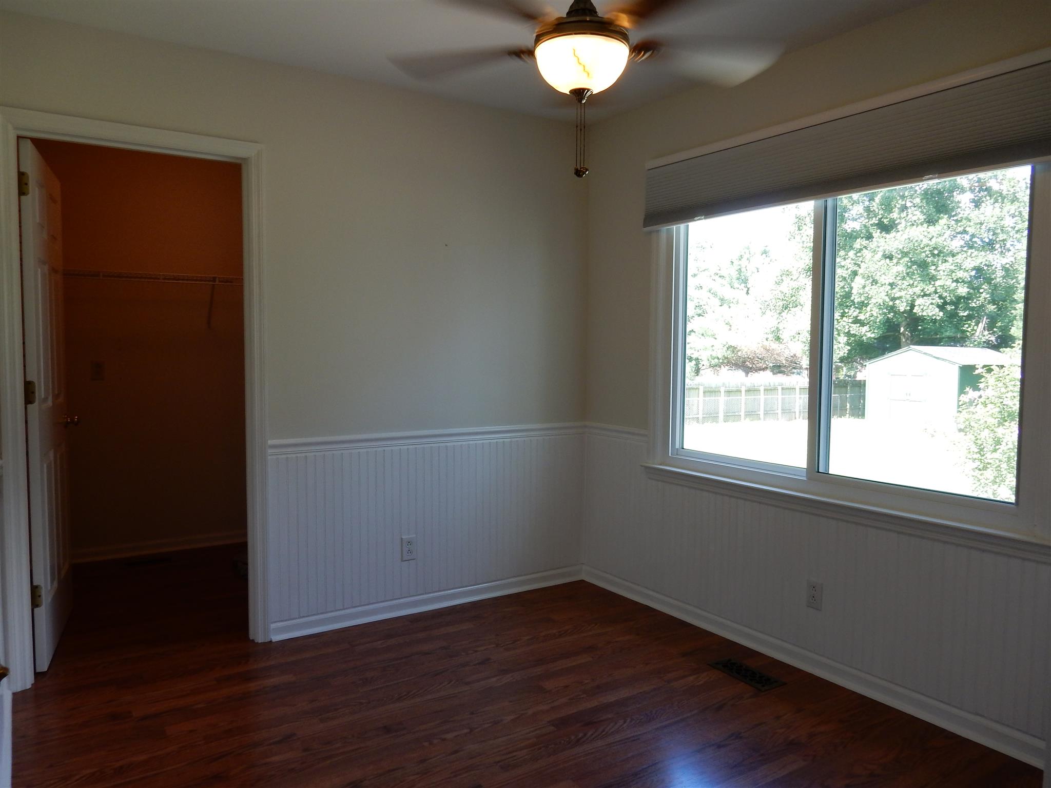 2884 Cages Bend Road Gallatin, TN 37066 - Photo 10 of 26 an empty room with wooden floor and windows