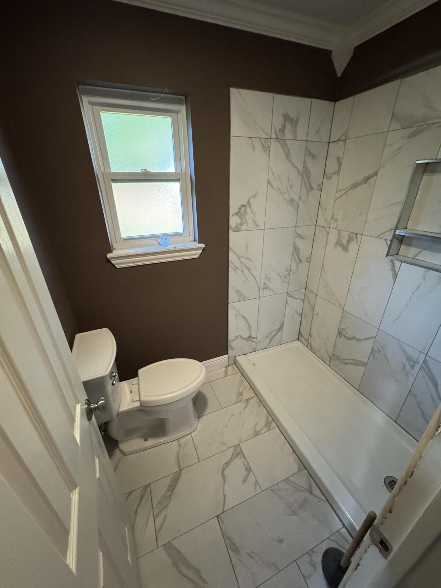 4402 78th Street Lubbock, TX 79424 - Photo 21 of 43 a bathroom with a bathtub and sink